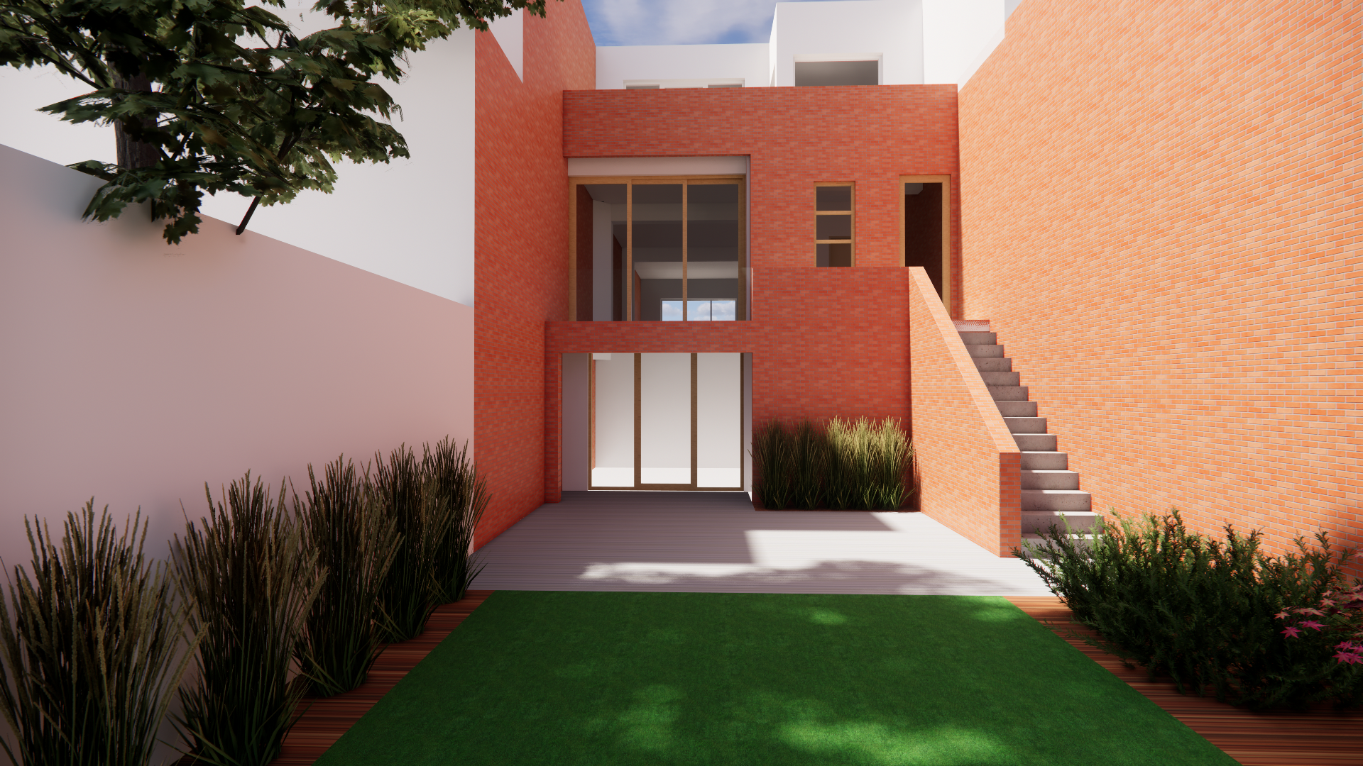 A modern house with red brick exterior walls, a staircase on the right side, and large glass windows facing a small front yard with green grass and tall bushes. A tree is visible on the left side, and the sky is partly cloudy.