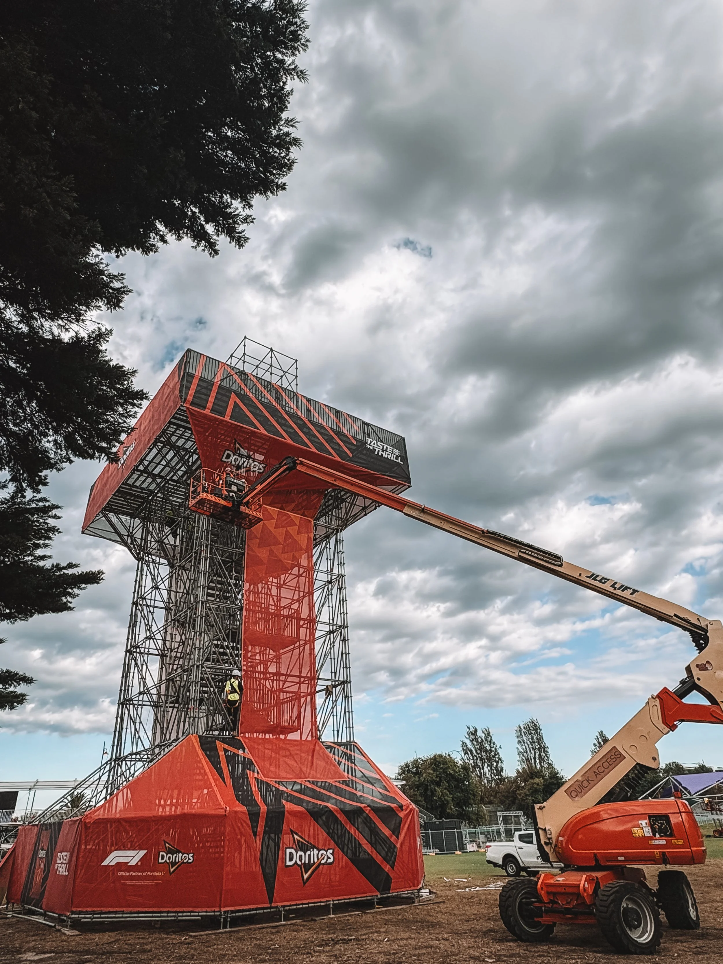 doritos tower wrap, large scale printing installed at height, oversize printed mesh banner and signs installed on scaffold.