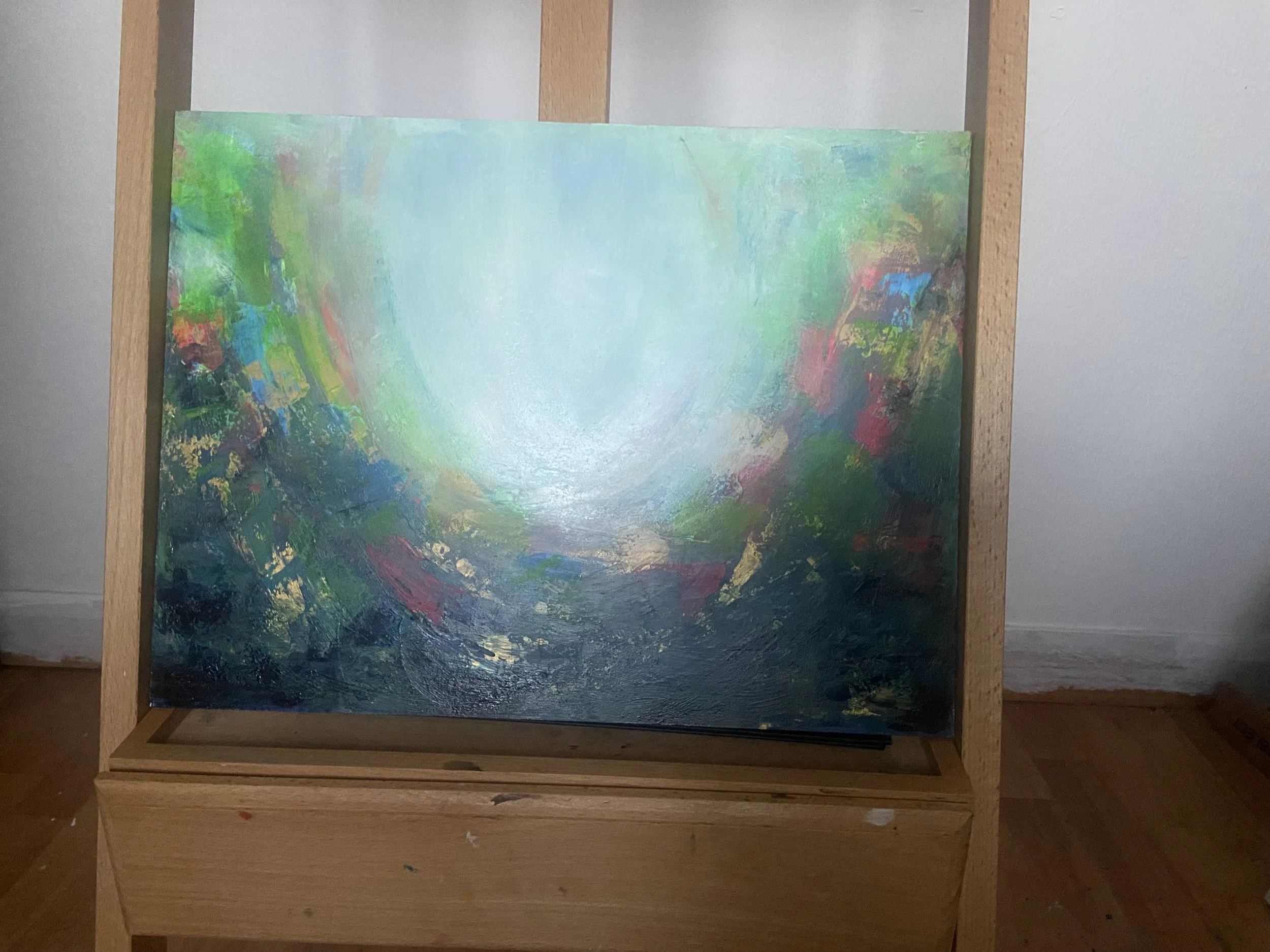 Colorful abstract painting on an easel.