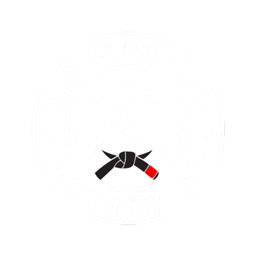A circular logo with the text "Mats in the Mountains" surrounding a mountain scene with a mountain range, three birds, and a tied climbing rope.
