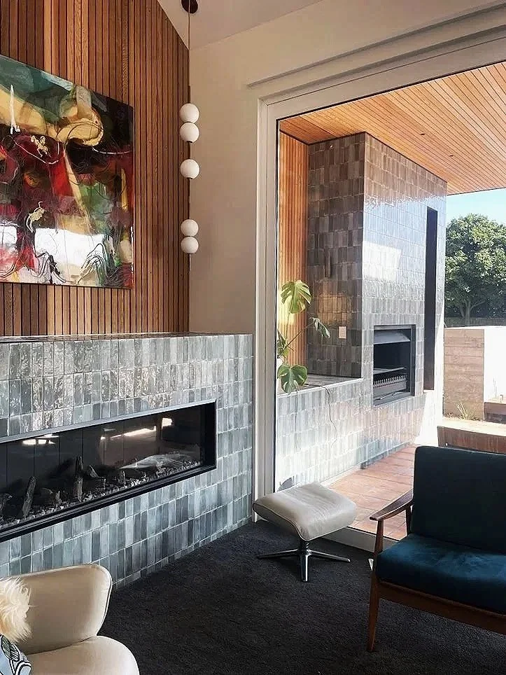 Linear fireplace with zellige tiles and timber slat wall, mid-century lounge design, Cambridge NZ
