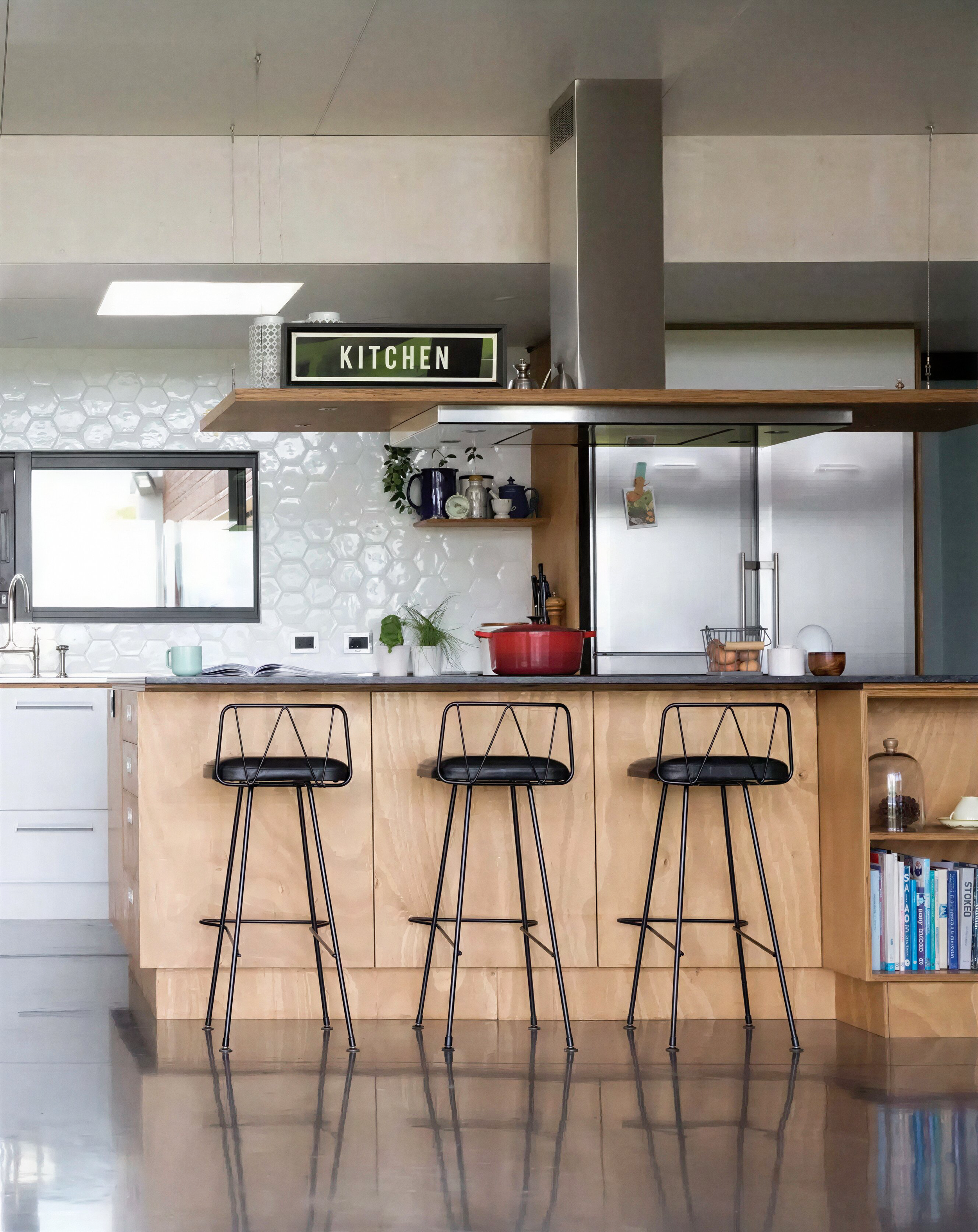 Plywood island kitchen with hex tile splashback and wire stools, Big Sky Farmhouse, Kaihere