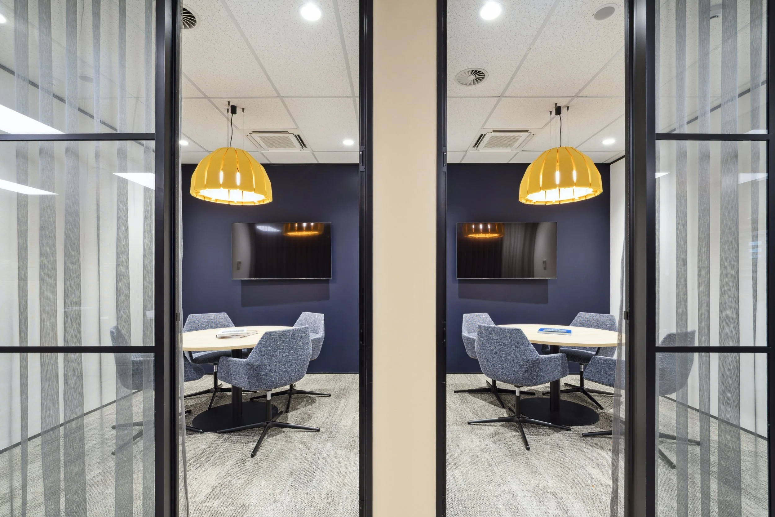 Meeting rooms with acoustic pendants and black steel glazing, Barfoot Thompson Pukekohe office fitout