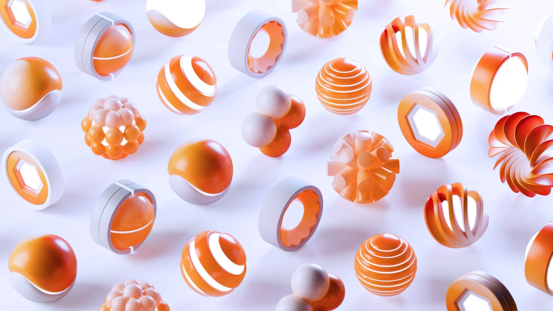 A collection of orange and white abstract geometric shapes floating against a white background.