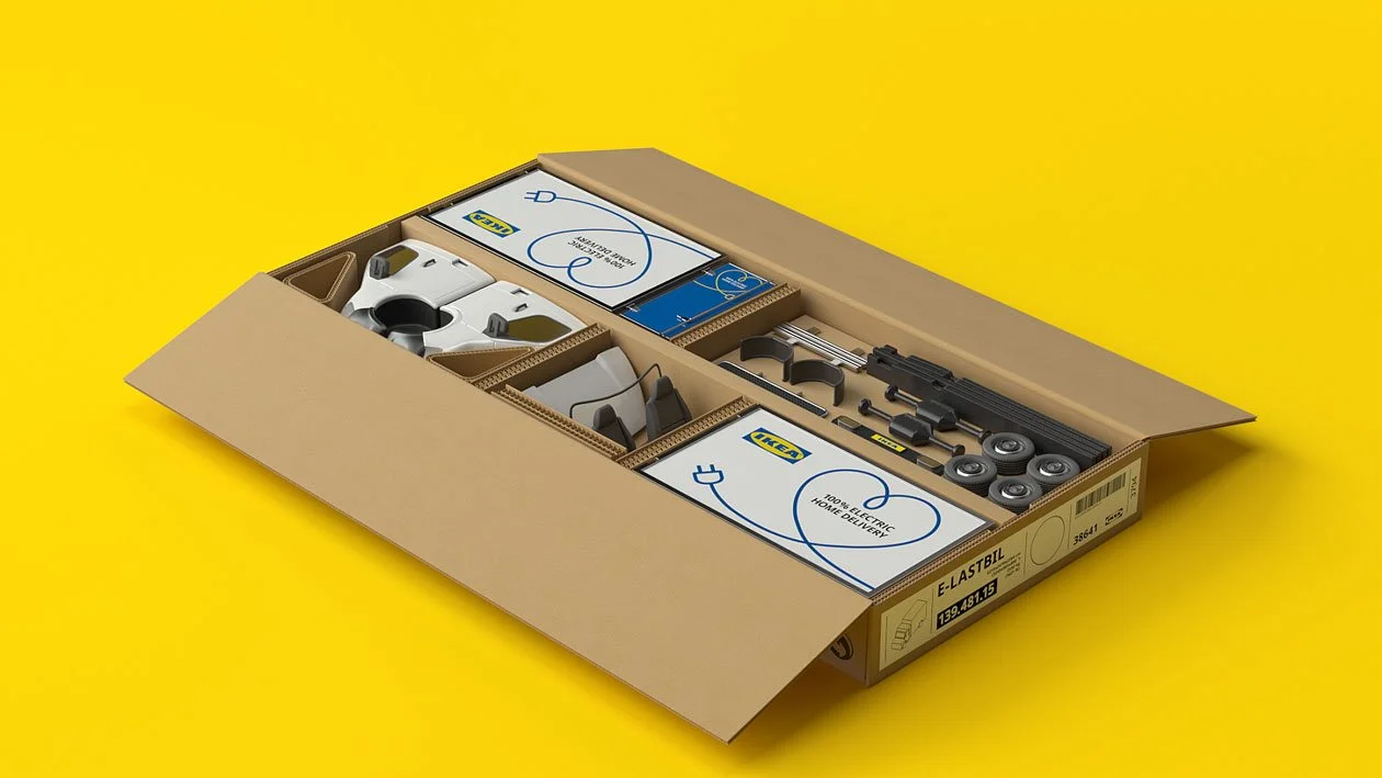 IKEA E-LAST BIL electric scooter parts and tools in a cardboard box with yellow background.