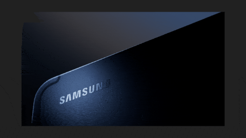 Close-up of a Samsung electronic device with a dark background.