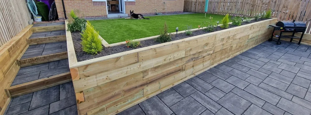 Timber sleeper raised bed installed by Team Bespoke