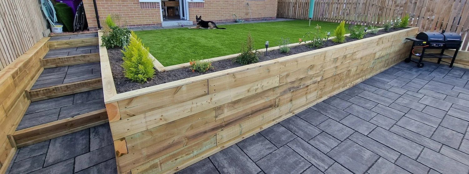 Timber sleeper raised bed installed by Team Bespoke