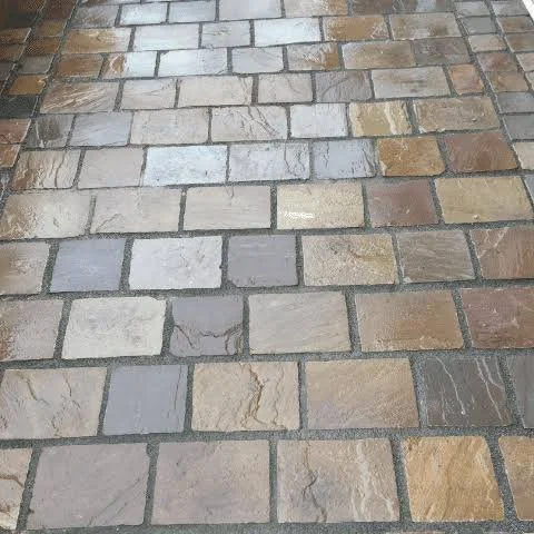 Mixed-colour natural stone paving installed by Team Bespoke