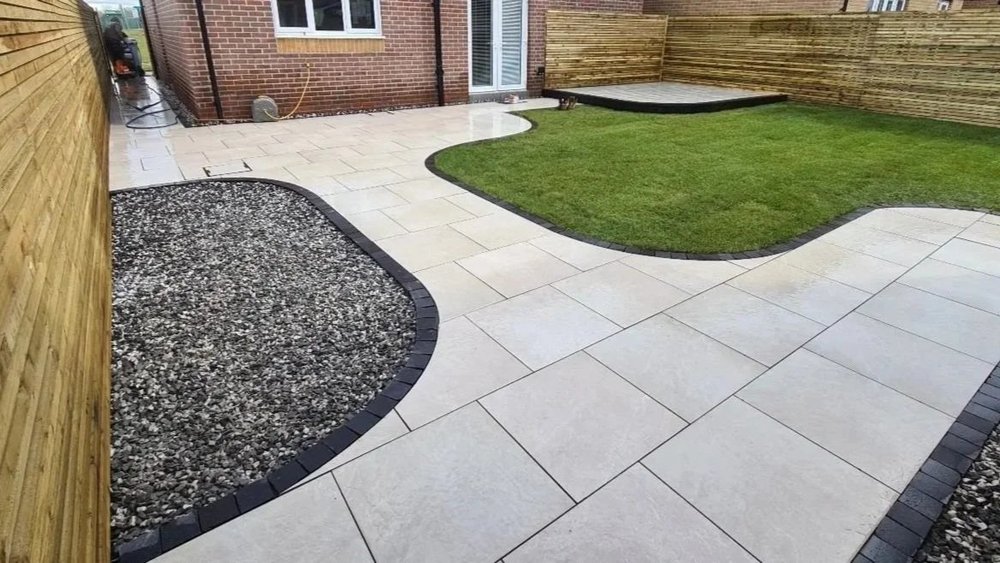 Porcelain garden pathway surrounding a shaped lawn