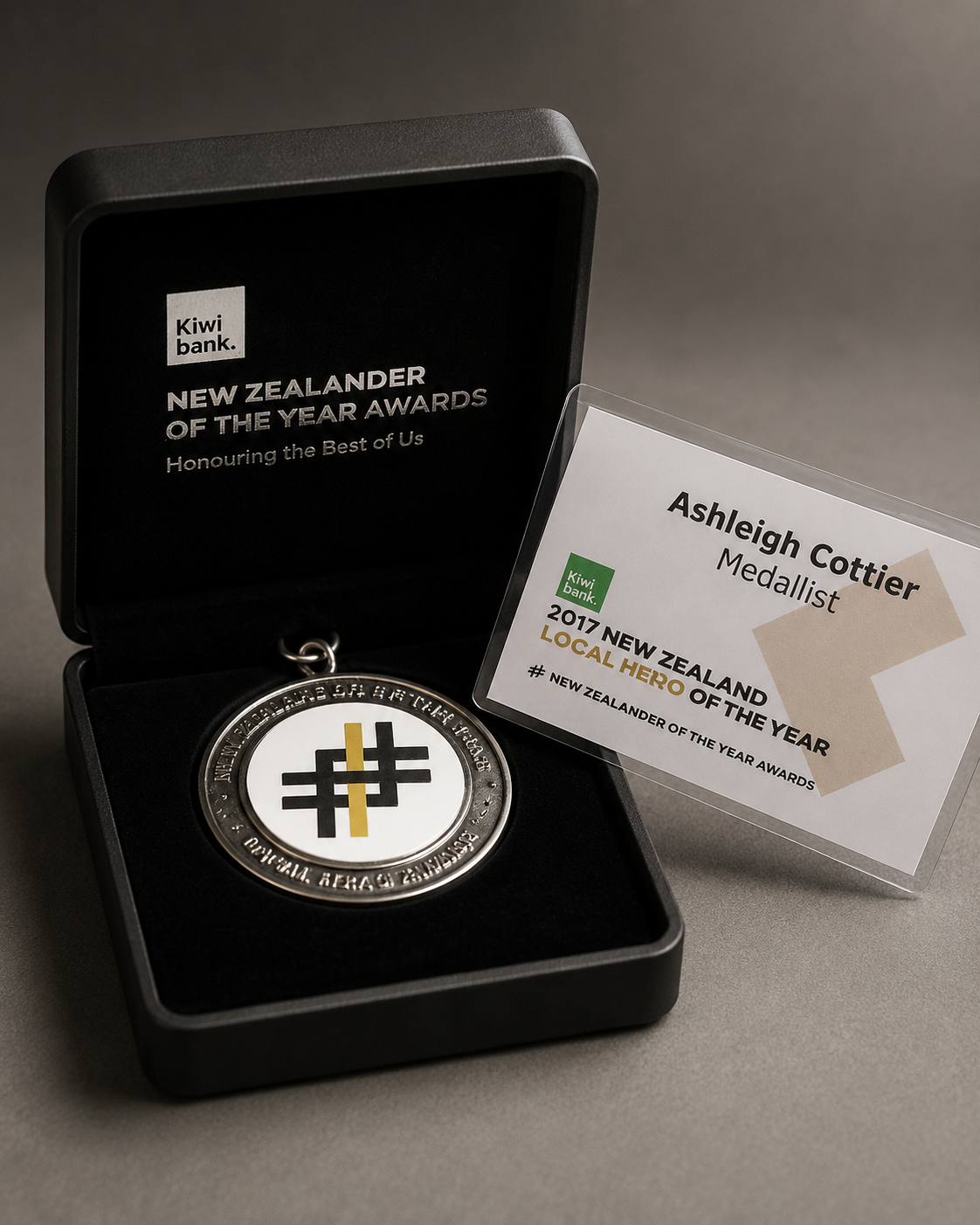 Ashleigh Cottier's 2017 Kiwibank New Zealander of the Year Local Hero of the Year medal in its presentation box with medallist certificate card
