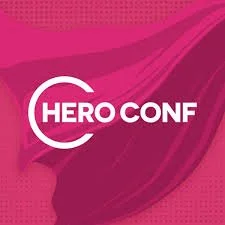 Logo of HERO Conf conference with pink and purple abstract background.
