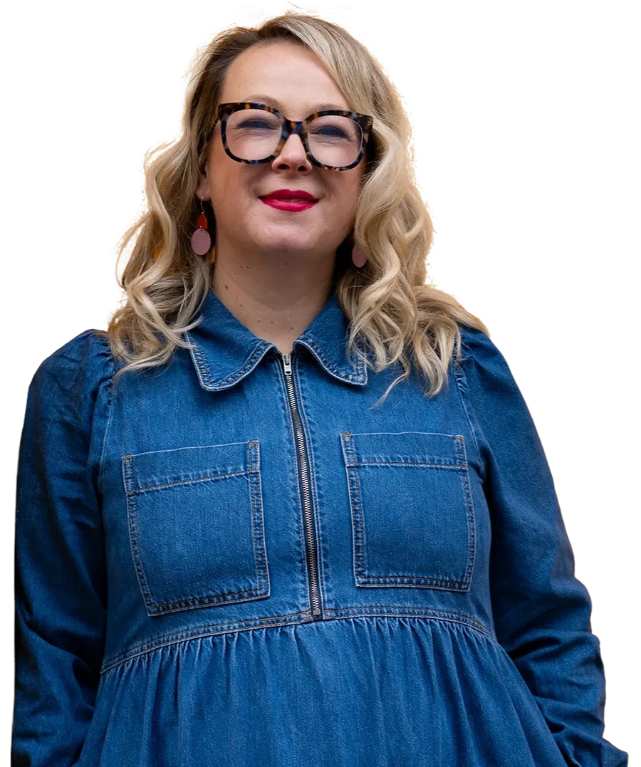 Aggie Meroni, Meta Ads strategist and founder of White Bee Digital, in a denim dress