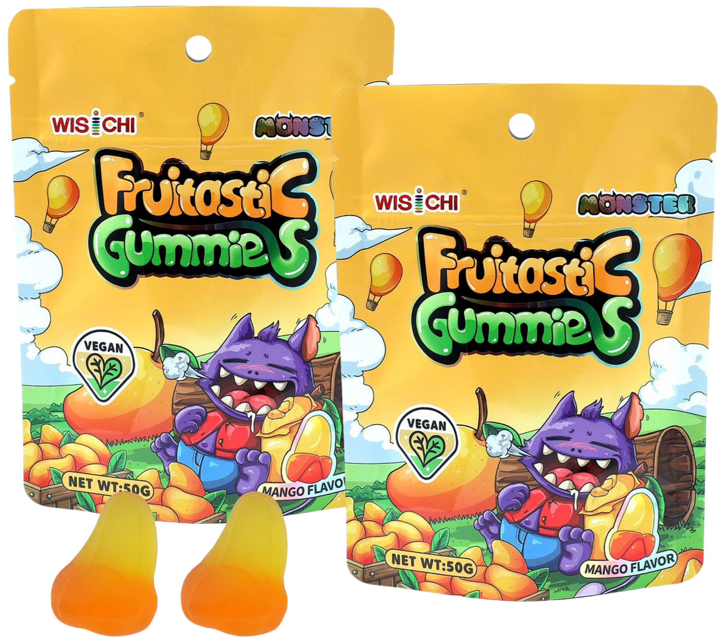 Packaging of vegan mango flavored fruitastic gummies featuring a purple cartoon monster with fangs, sitting in a green field with a basket of mangoes. The packaging is yellow with clouds and hot air balloons, and indicates a net weight of 50 grams.