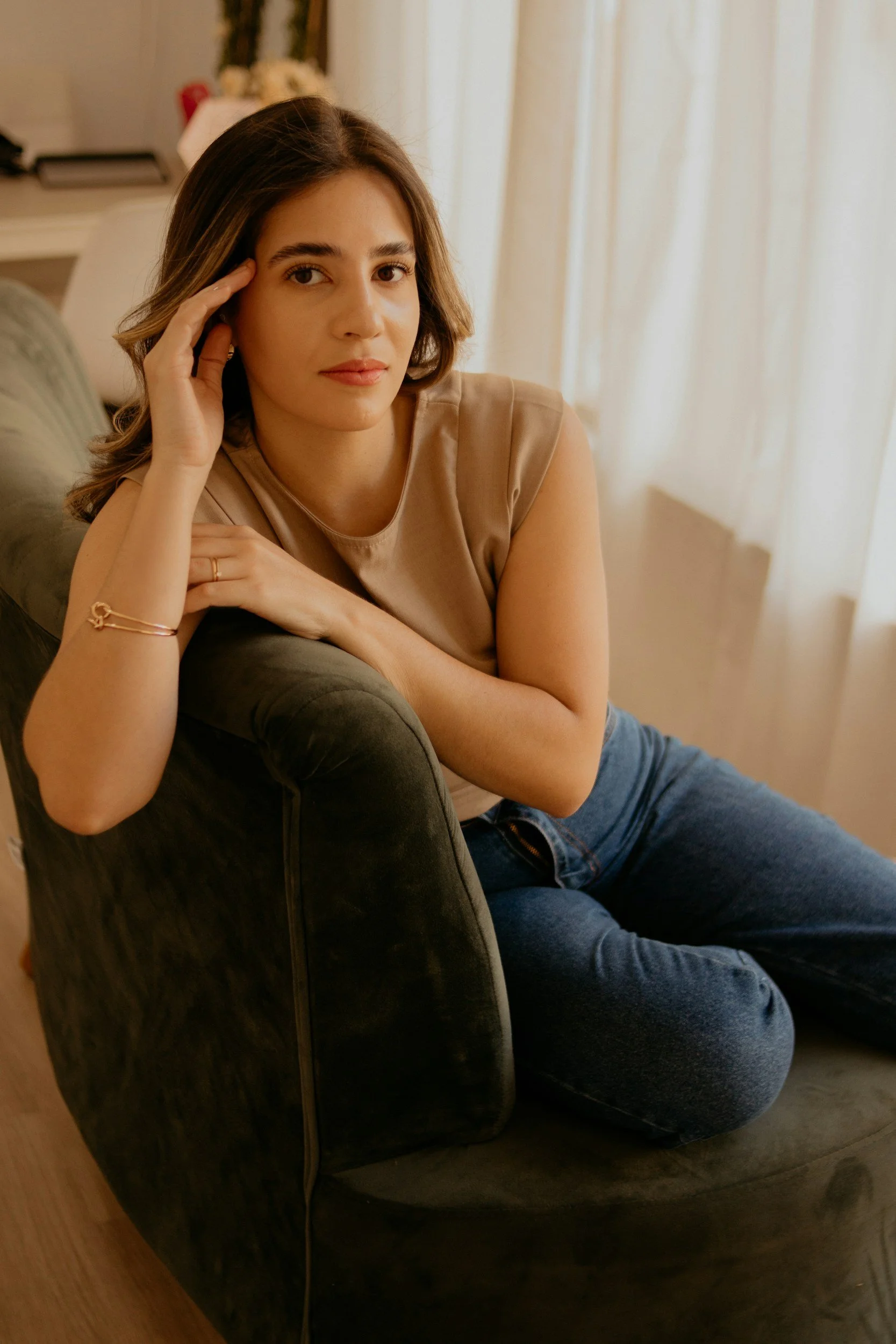 Woman sitting on couch with sexual trauma