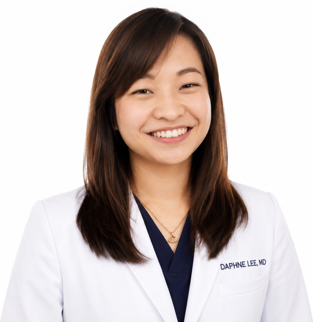 A smiling female doctor or medical professional wearing a white coat with her name and title 'Daphne Lee, MD' embroidered on it, against a plain white background.