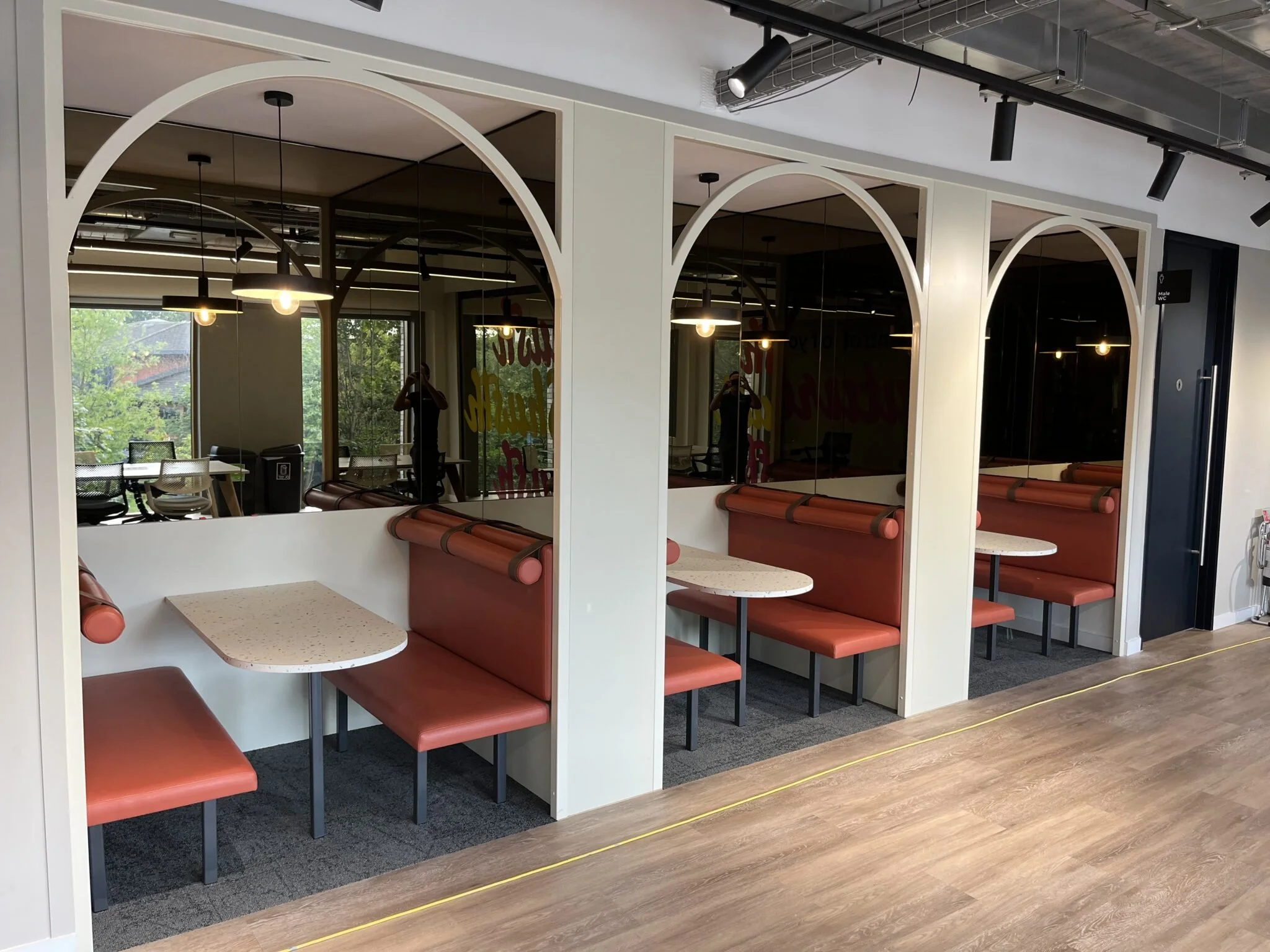 Powder-coated steel arch detail to seating booths 2.jpg