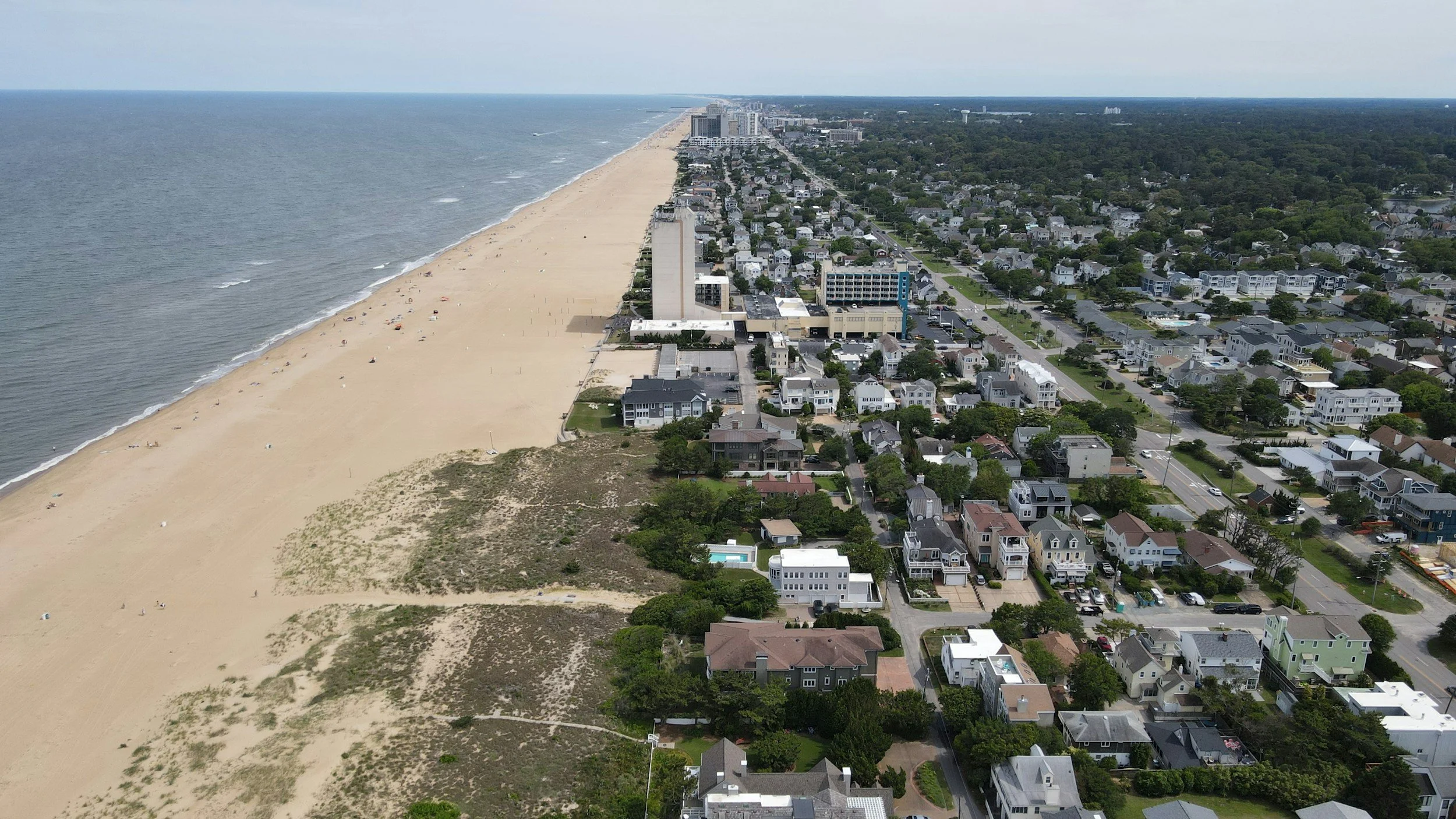 Aerial view of Virginia Beach oceanfront including homes and businesses