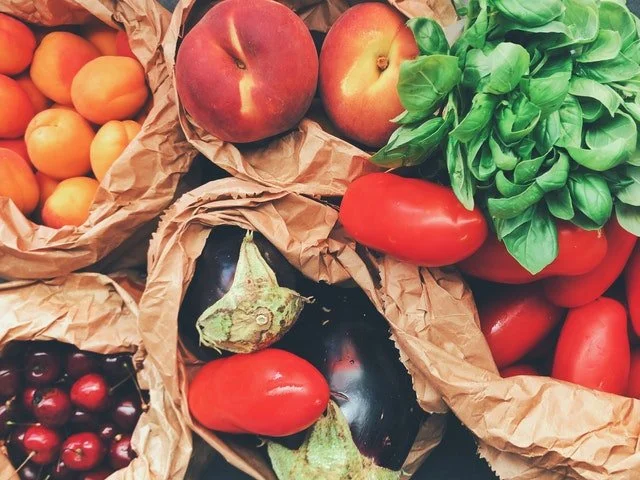 fruits and vegetables in brown paper bag