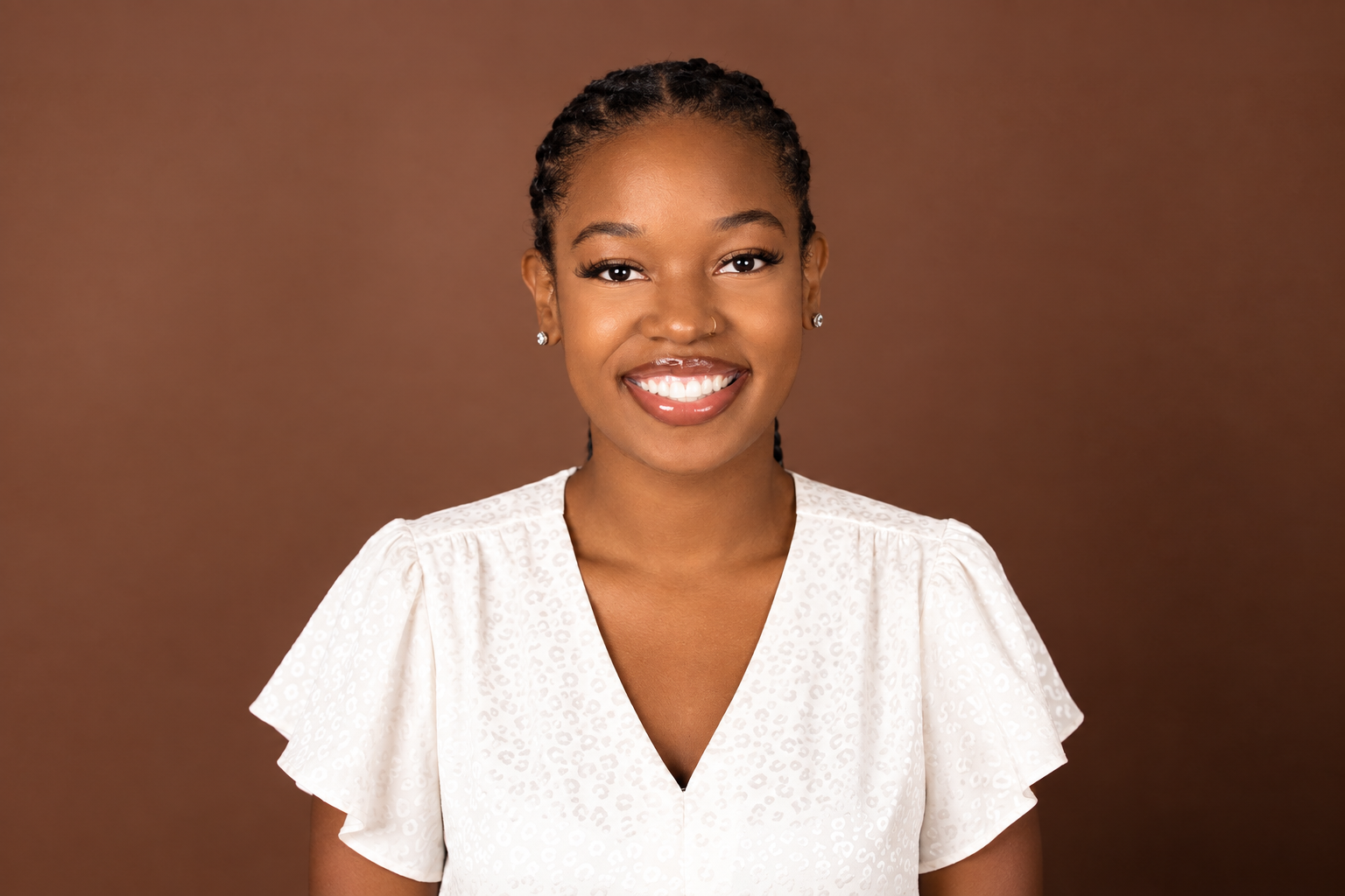 woman smiling in white shirt
