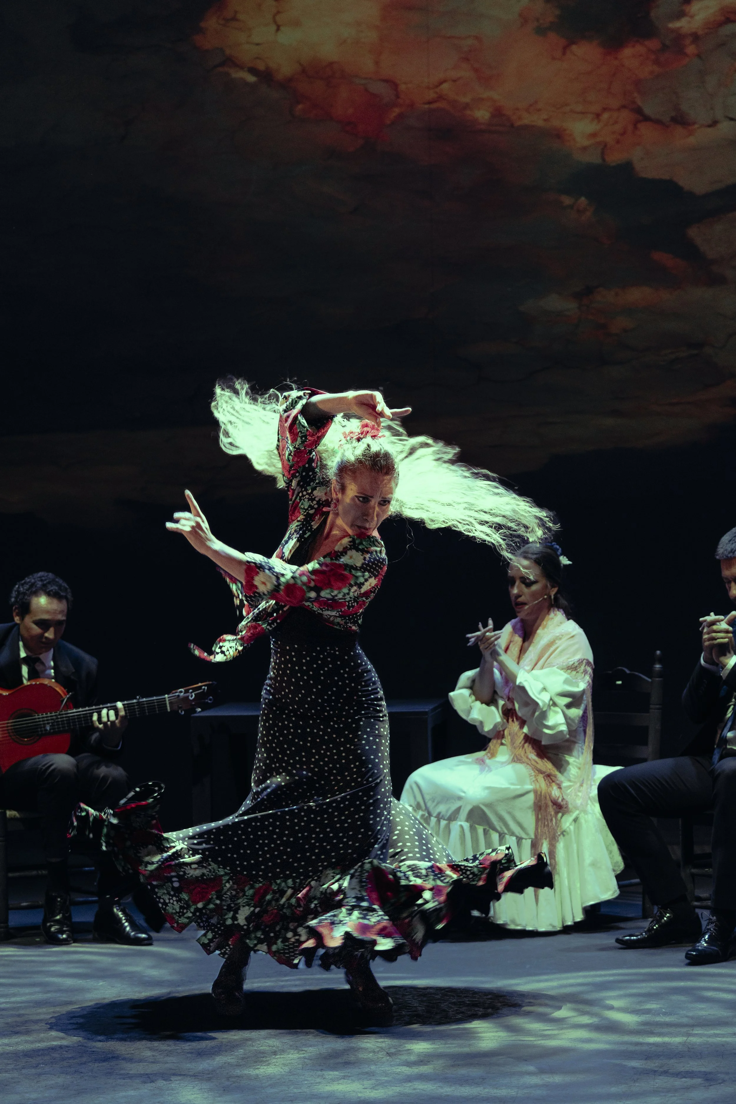 Irene La Sentío performing flamenco on stage in Seville