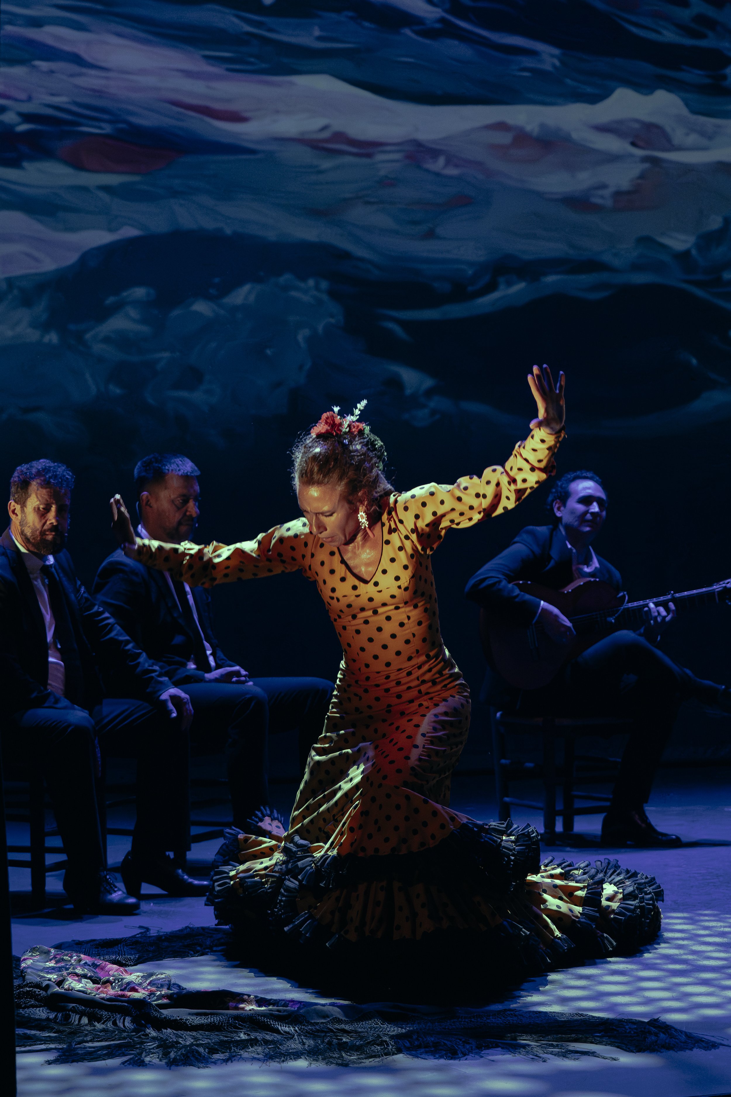 Irene La Sentío dancing with live flamenco musicians on stage
