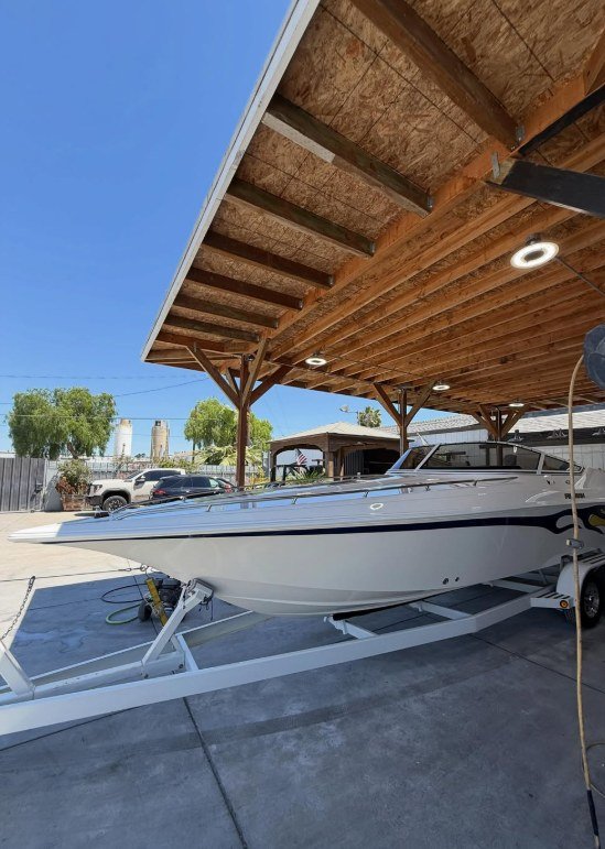 boat under covered in Sergio's boat spa boat repair shop under the shade