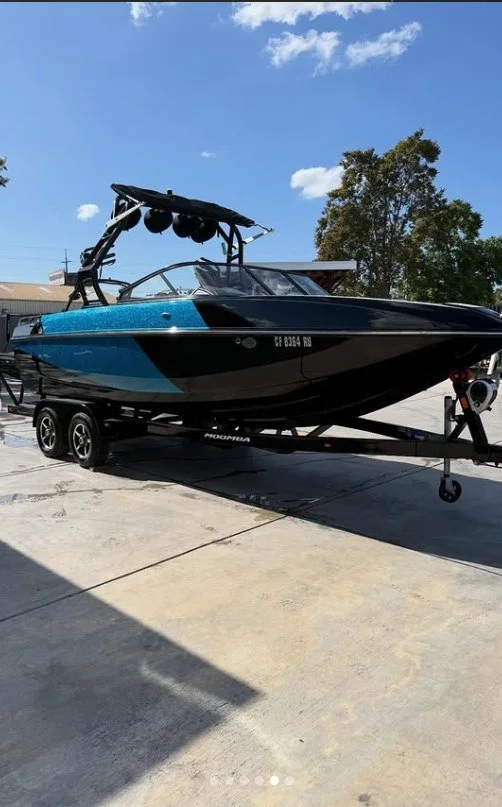 blue/ black boat painted at sergio's boat spa shop