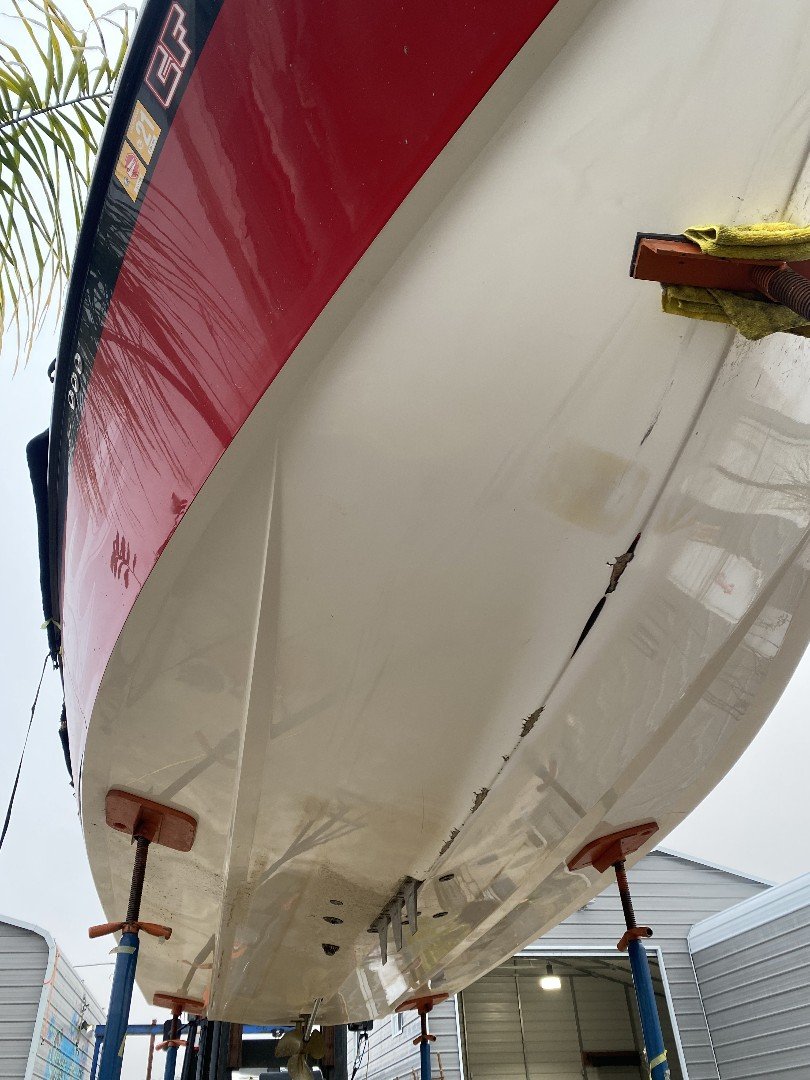 Boat hull restored after fiberglass and gelcoat repair in Stockton by Sergio's Boat Spa