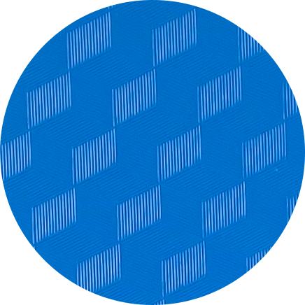 Close-up of a blue circular surface with a geometric pattern of raised squares with striped and textured surfaces