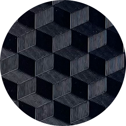 Close-up of a hexagonal pattern with dark, textured surfaces.
