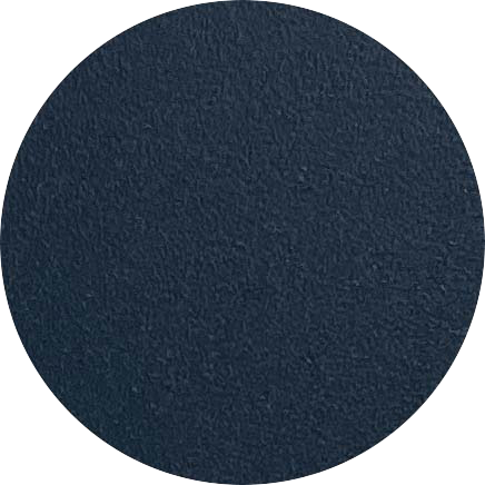 A close-up of a dark blue textured circular object, possibly a rubber or foam pad.