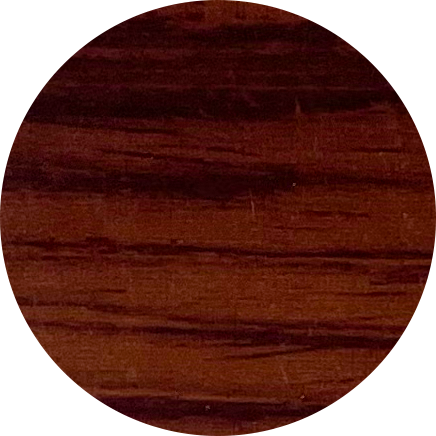 Close-up of a dark wooden surface with a rounded edge.