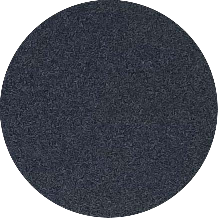Close-up of a textured, black circular object.