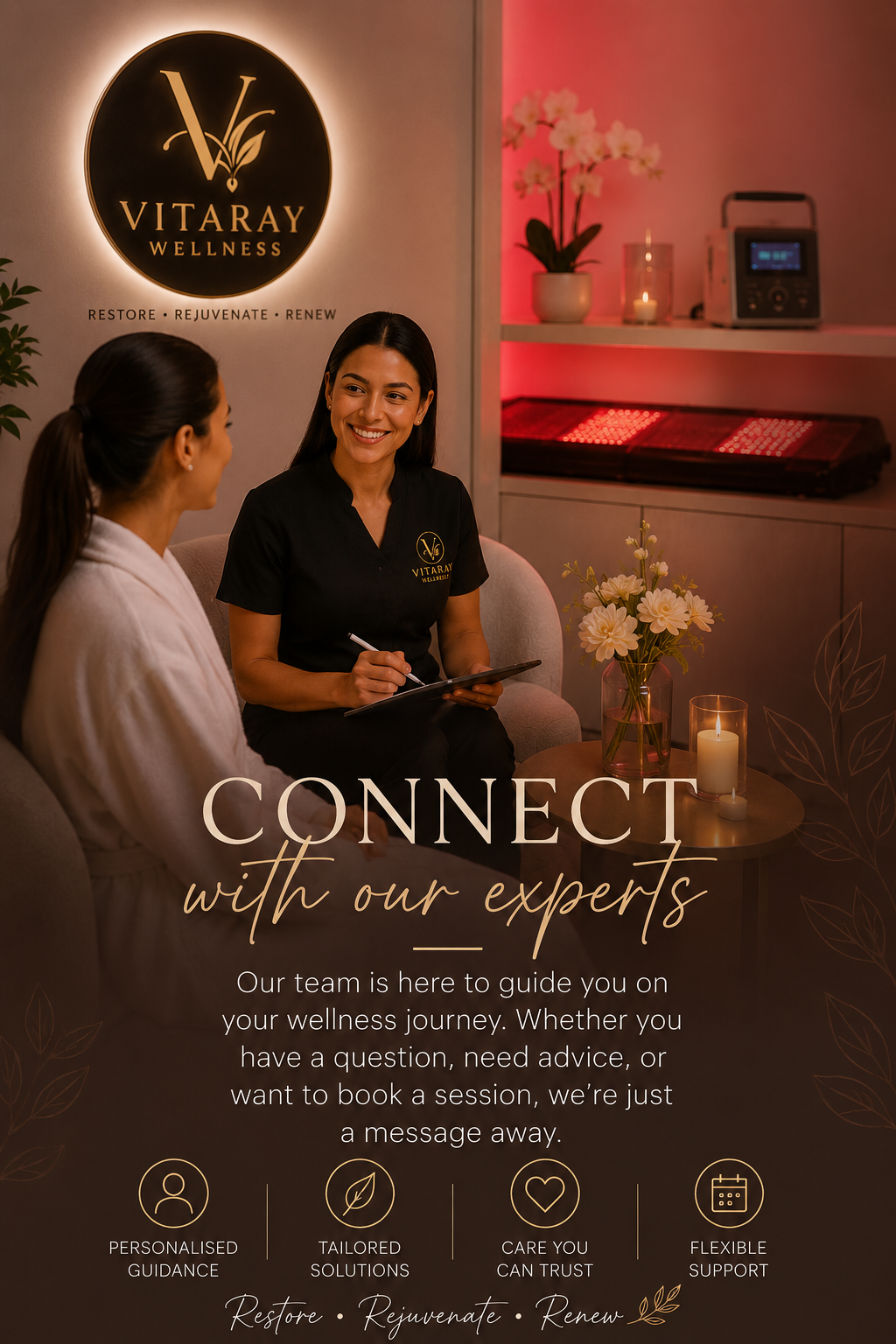 A woman in a black uniform with the Vitaray Wellness logo talking to a client in a white robe in a wellness center. The background features a sign with the Vitaray Wellness logo, orchids, candles, and wellness equipment. The image promotes connecting with wellness experts for guidance, advice, or booking sessions.