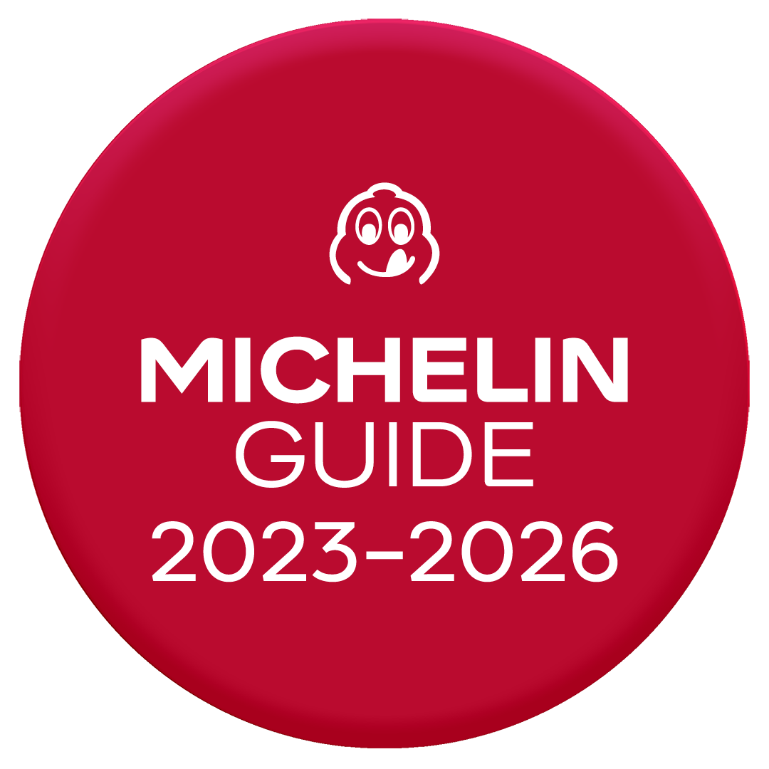 Red circular badge with the Michelin Guide logo and text indicating the 2023-2026 edition.