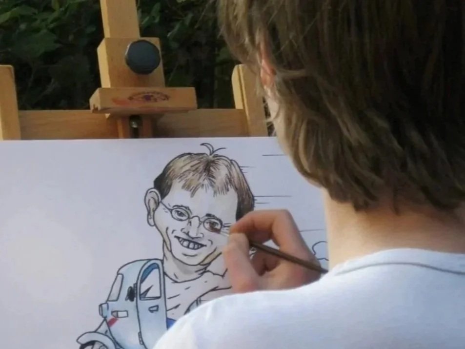 Person creating a detailed black and white caricature of a boy with glasses and a backpack.
