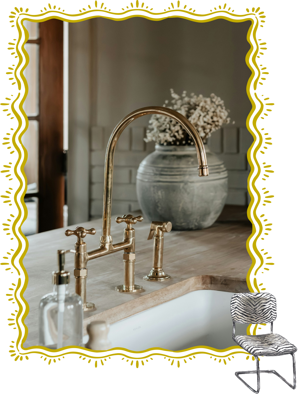 A farmhouse kitchen sink with brass faucet and a large gray vase with white flowers on a wooden countertop.