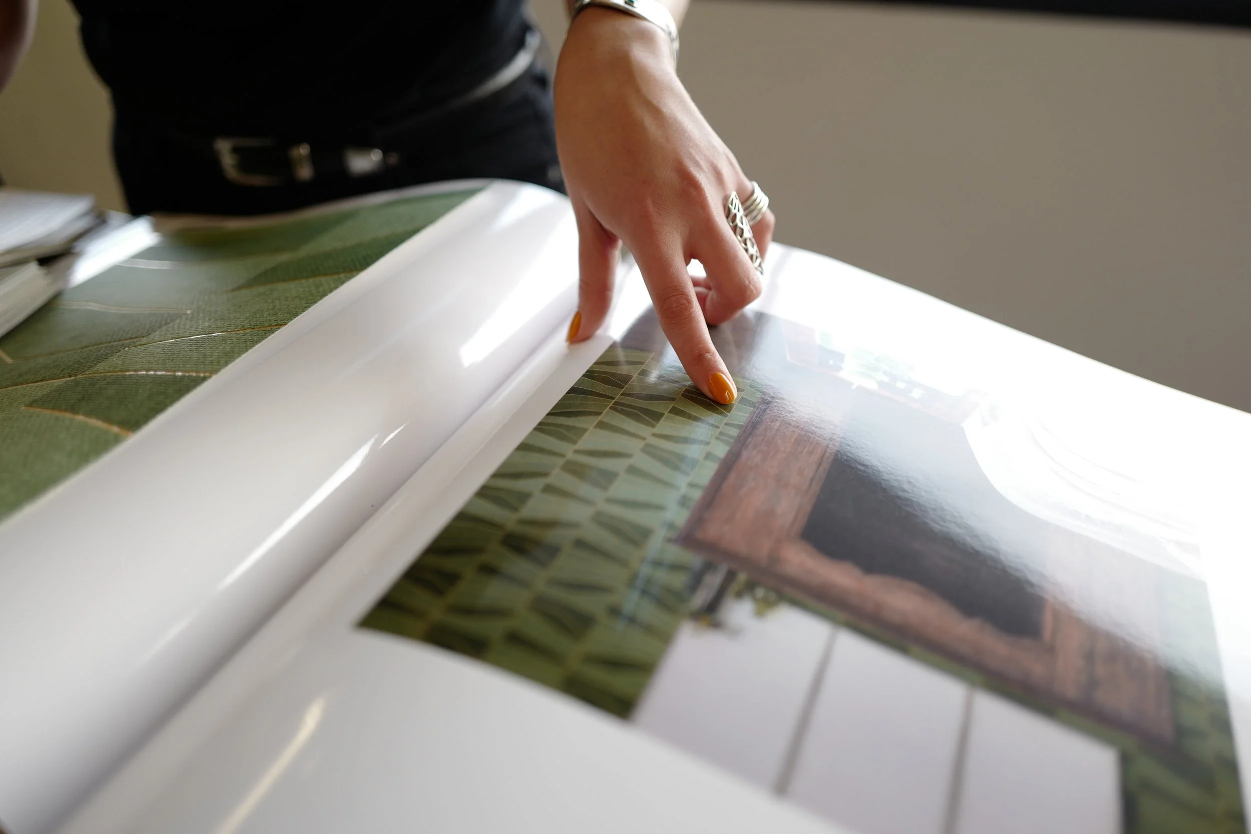 Interior designer reviewing architectural rendering with material selections during design development