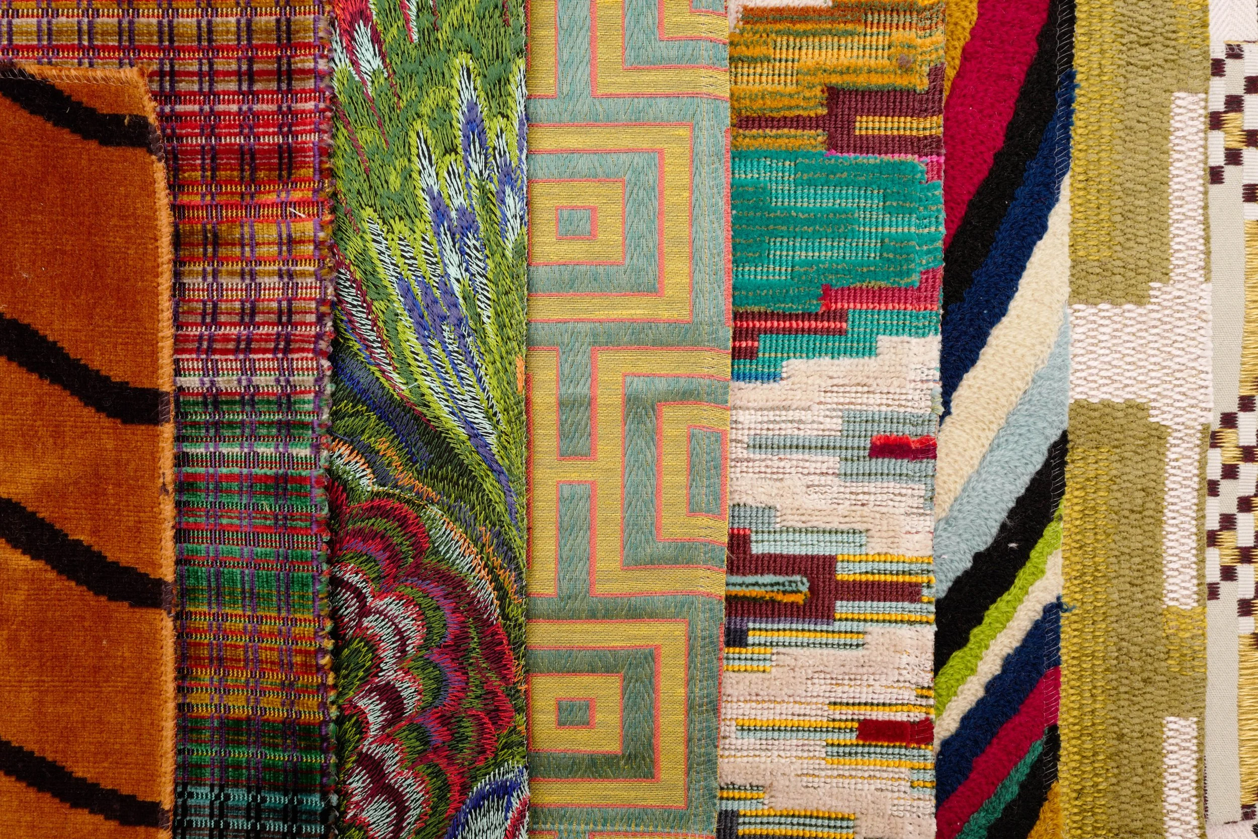 Collection of colorful eclectic area rugs with bold geometric and botanical patterns