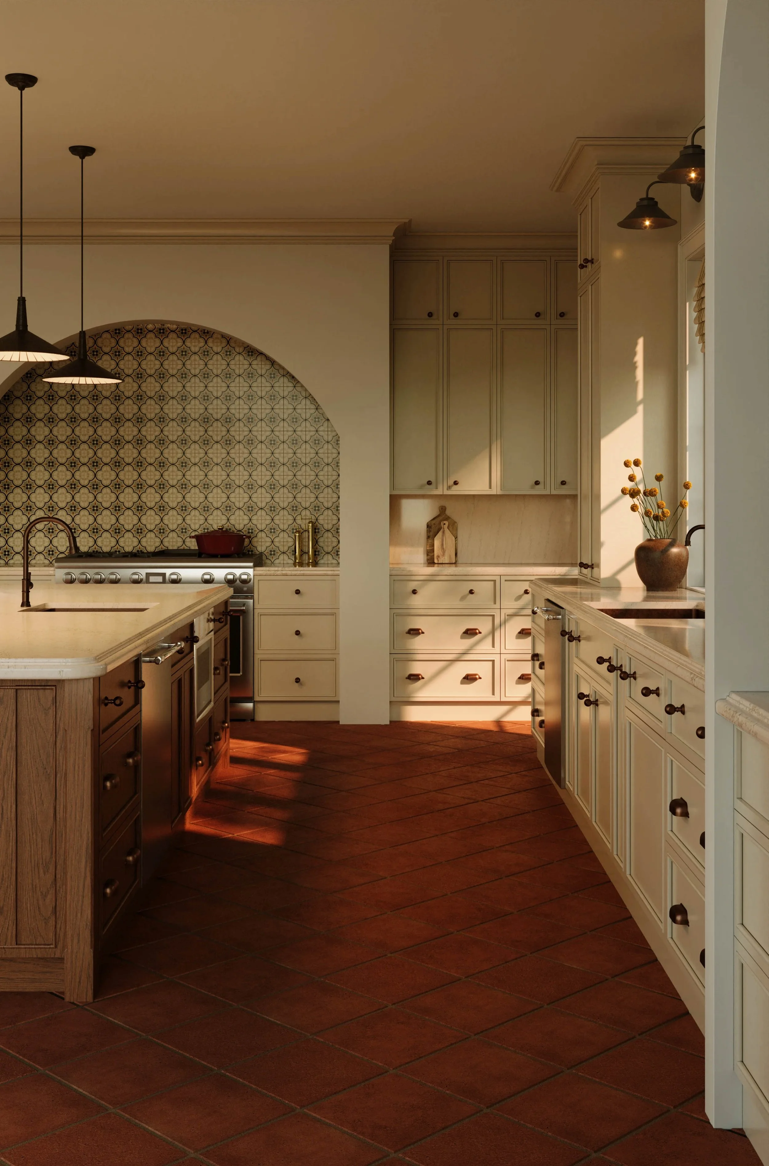 A kitchen with a tiled backsplash, white cabinetry, and two pendant lights hanging above a kitchen island. There is a vase with flowers on the counter near a window, and warm sunlight streams through the window onto the cabinets.