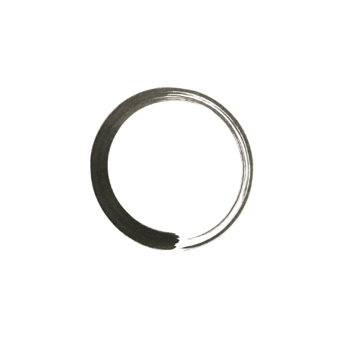 Close-up of a metallic snap ring or retaining ring on a dark surface, with colored background behind.