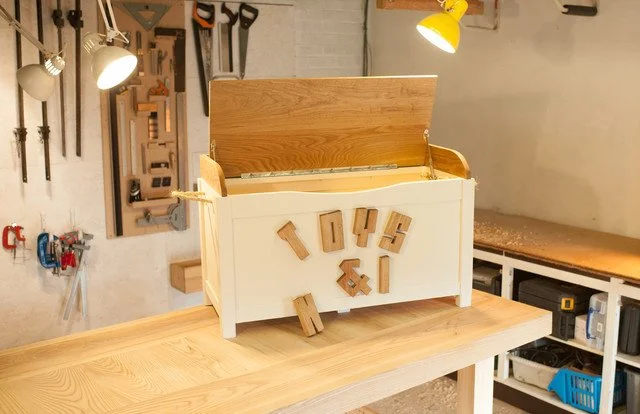 Bespoke toy box with magnetic lettering and oak lid seating