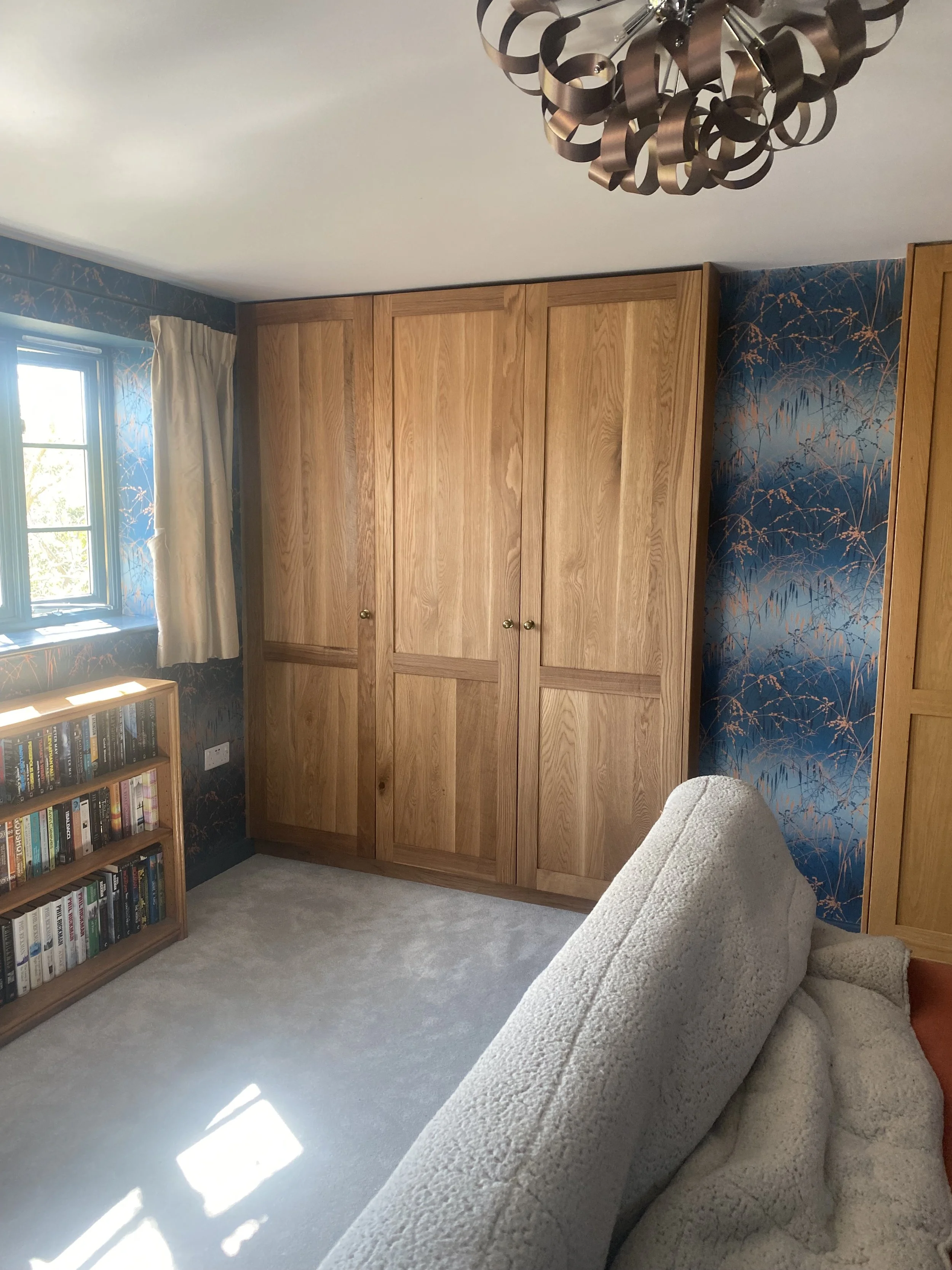 Fitted oak alcove wardrobes in oak