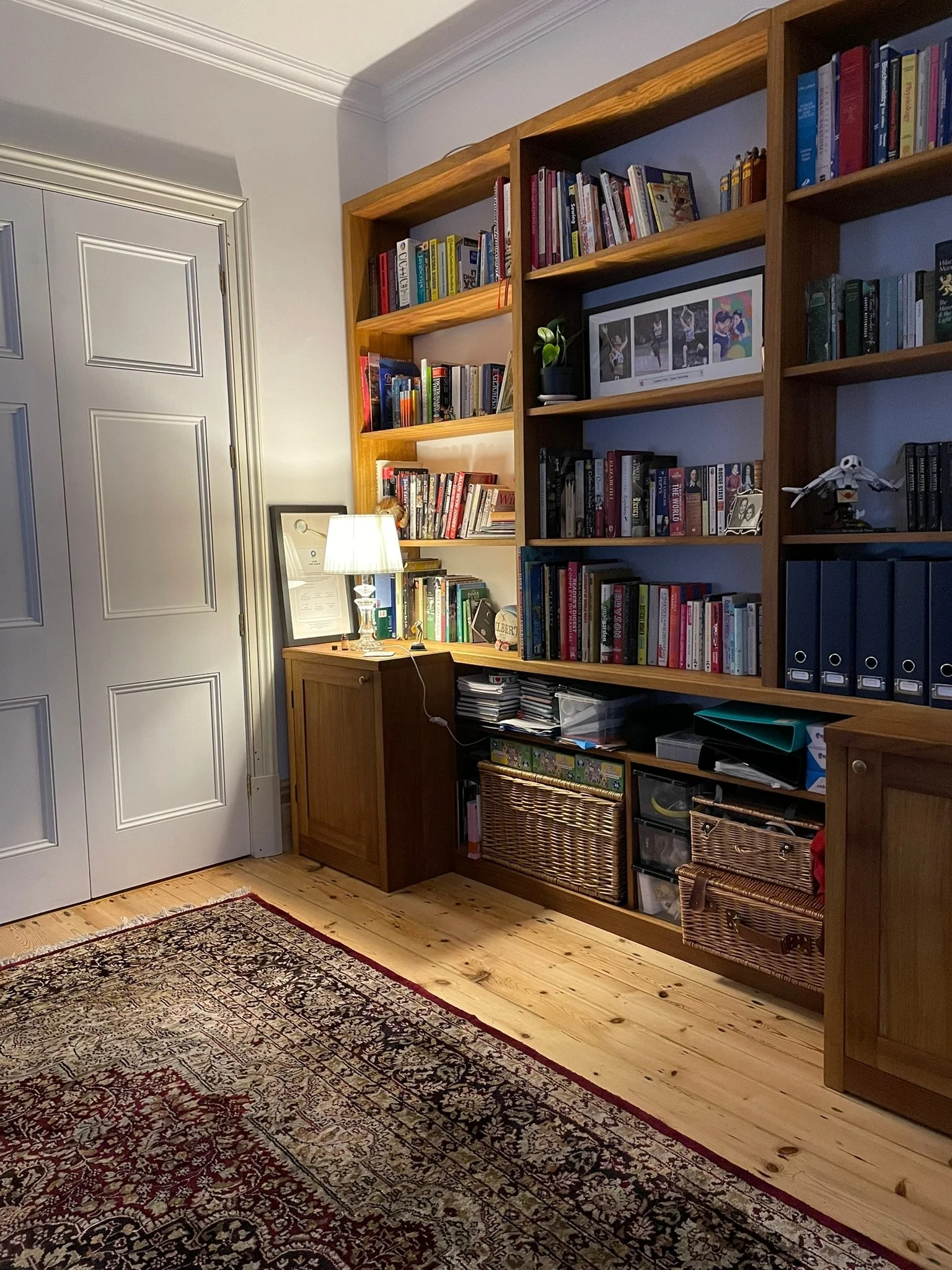 Large bookcase with additional cupboard in iroko
