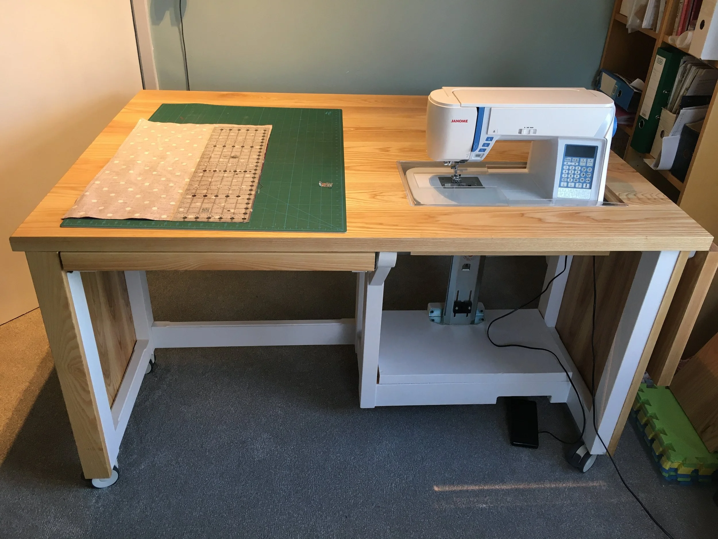 Ash sewing table with emerging sewing machine and extendable sides