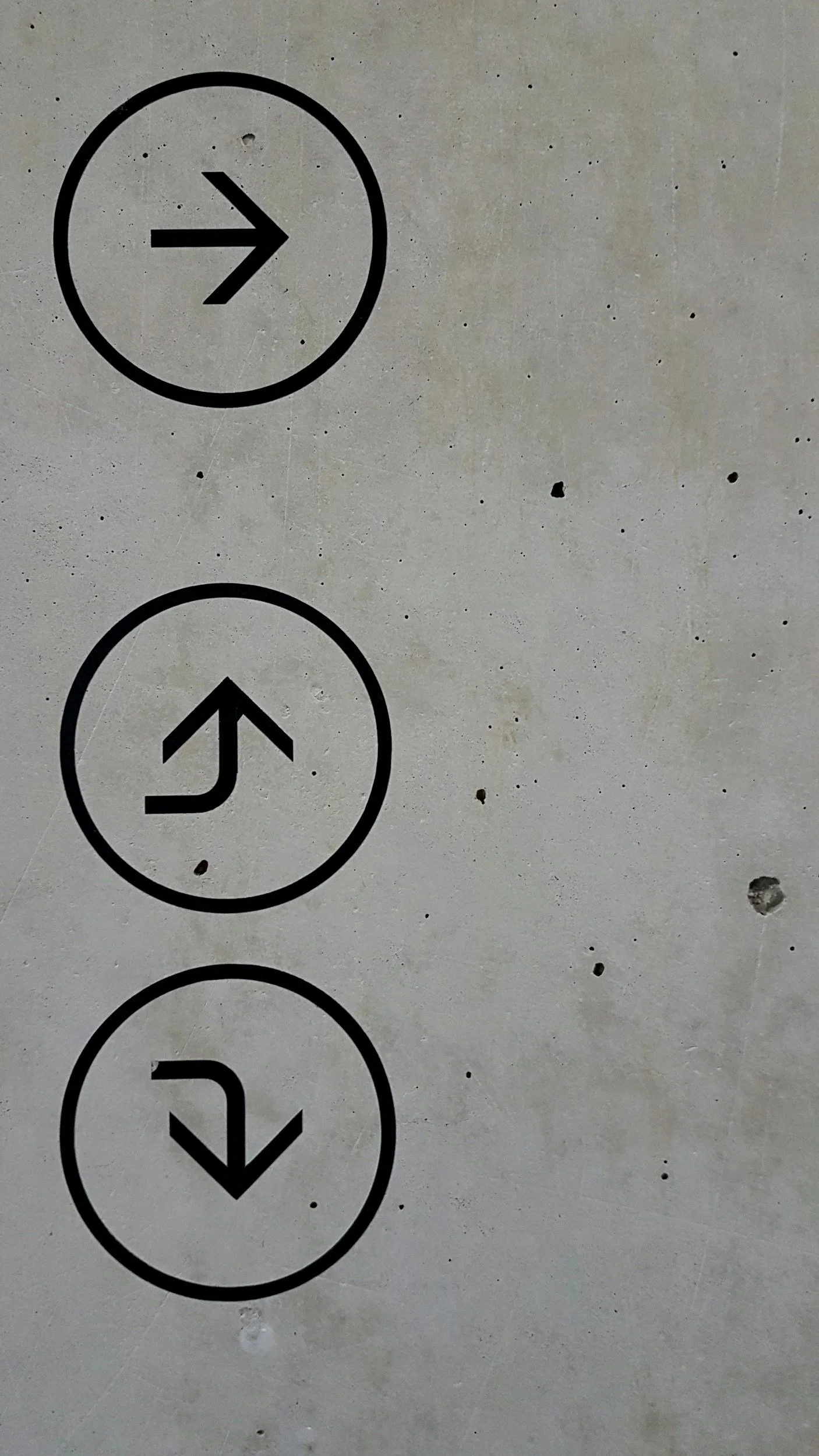 Close-up of elevator control buttons with arrows pointing up, down, left, and right.