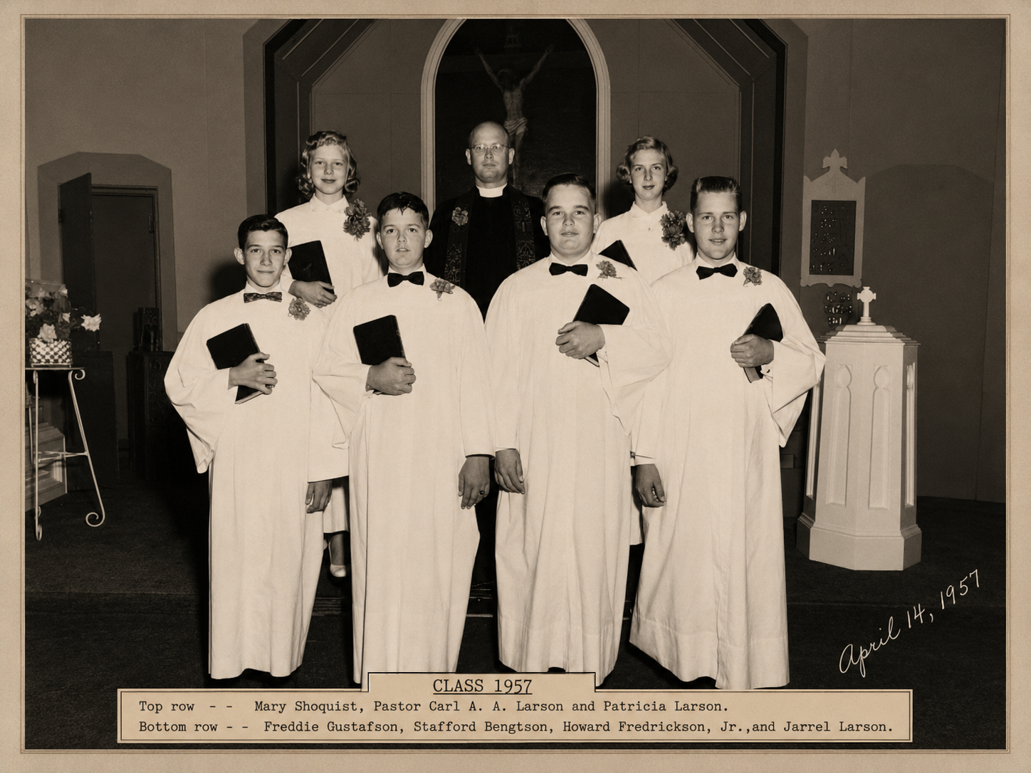 Bethlehem Lutheran Church confirmation class of 1957, Lund, Texas — seven confirmands in white robes with three pastors, inside the original 1899 church building.