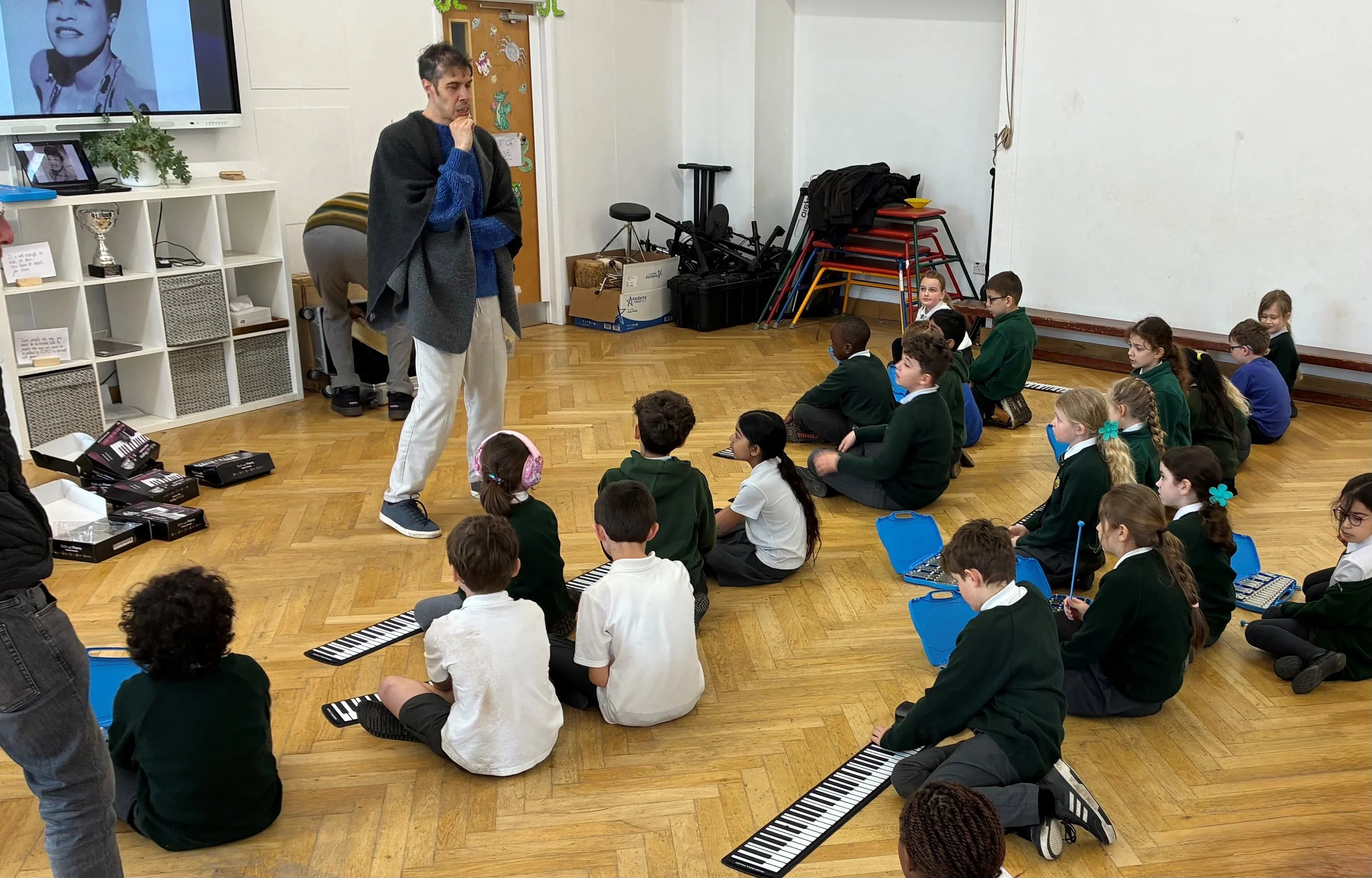 Working with the children on their own improvisations, using instruments within the school.