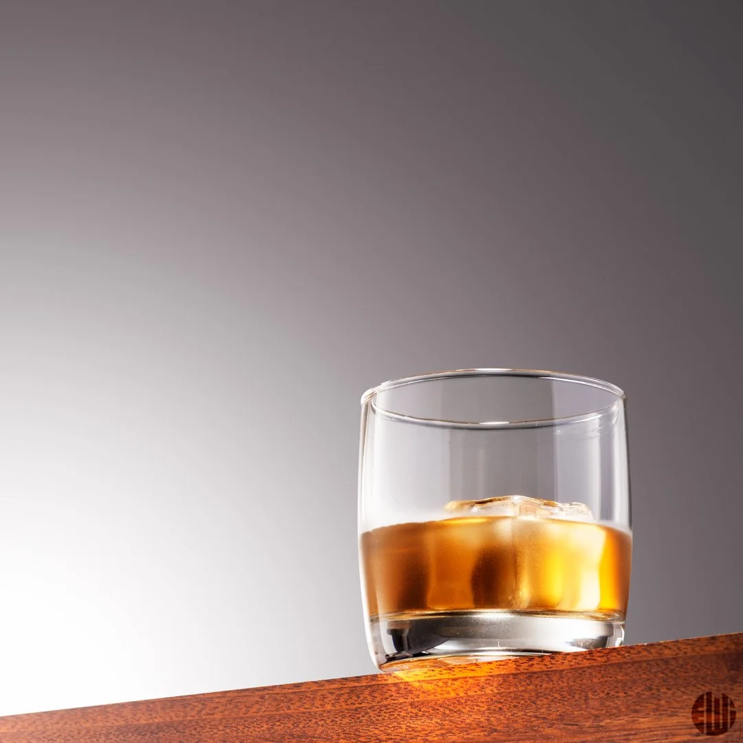 WhiskyGlassOverWoodWithGradientBG.jpg